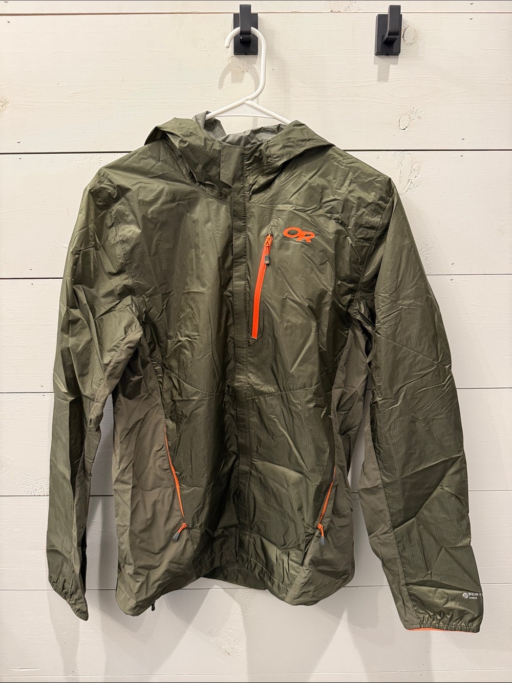 Outdoor Research Helium II jacket in green with orange zipper details. - Picture 2 of 7